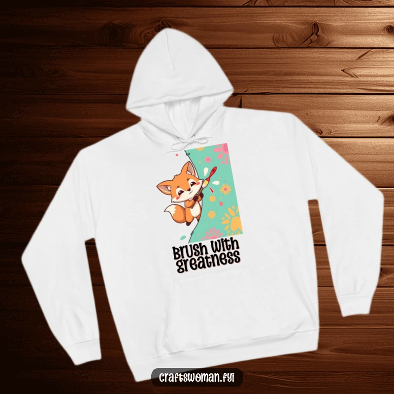 Funny Hoodie with a determined fox enthusiastically painting a vibrant pattern onto fabric, perfect for artistic comfort.