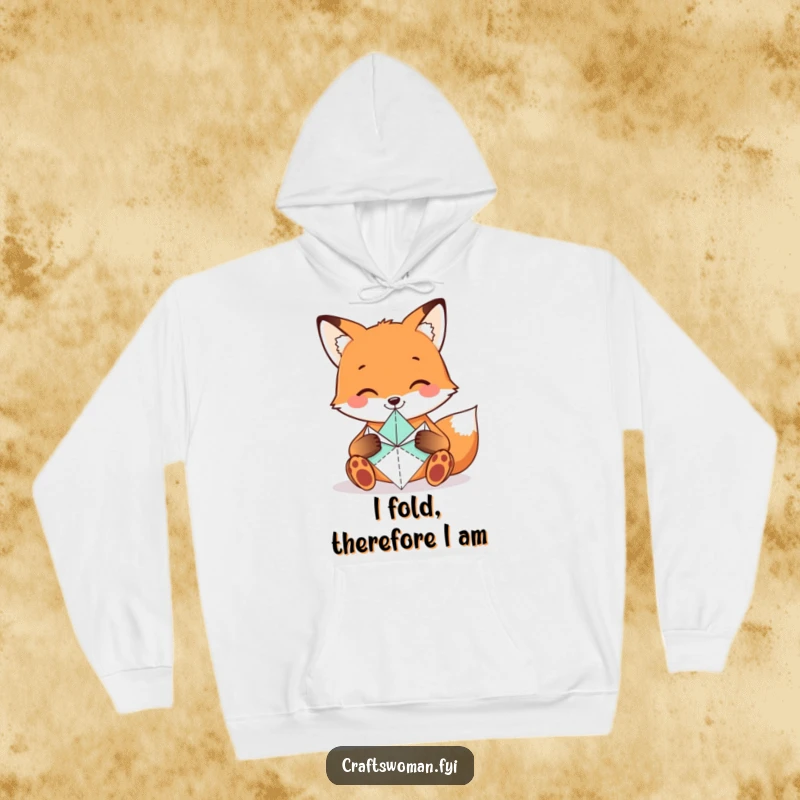 Funny Fox Hoodie showcasing a smiling fox carefully folding origami shapes with tiny paws, a cozy gift for artists.