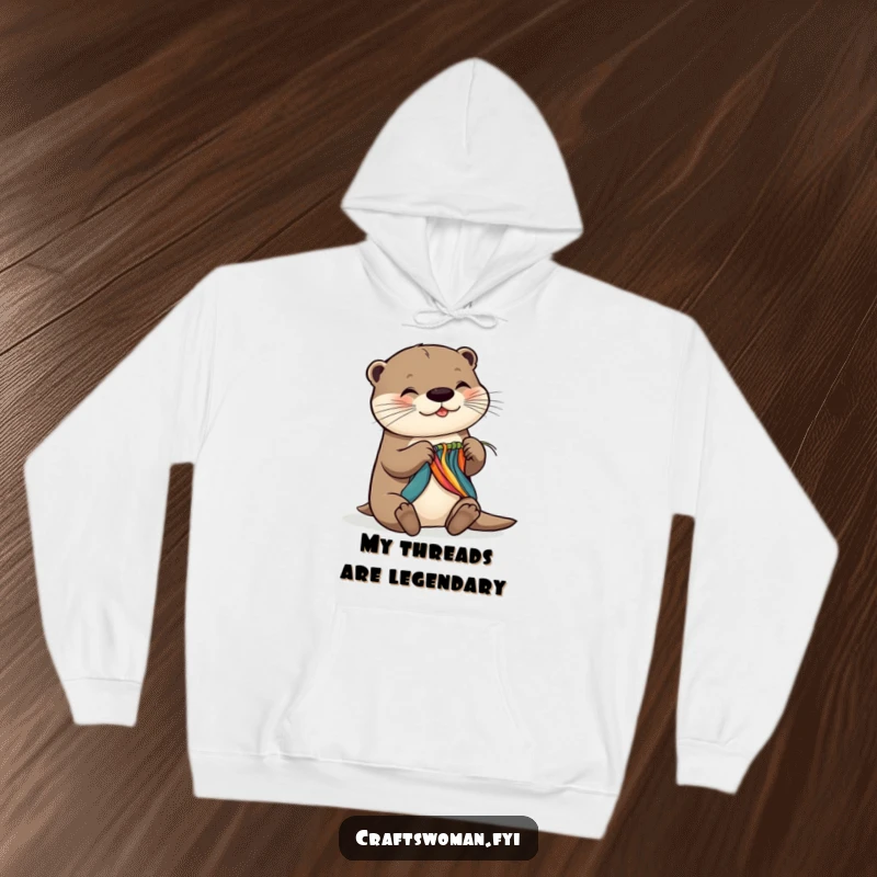 Funny hoodie with a joyful otter expertly weaving colorful threads, showcasing incredible dexterity and a mischievous, happy demeanor.