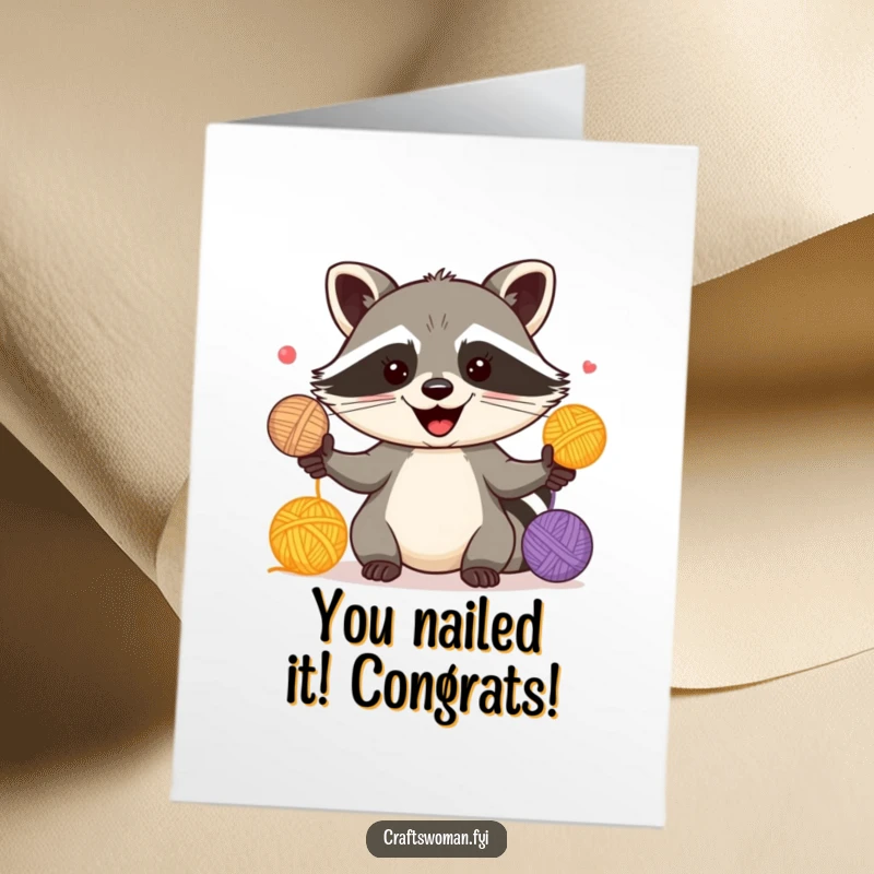 Funny Free Printable Congratulations Card: A happy raccoon with a sly grin expertly juggles bright balls of yarn.