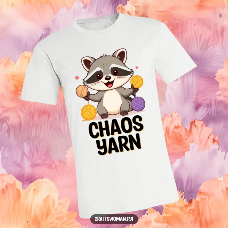 Funny t-shirt of a happy raccoon energetically juggling multiple colorful yarn balls, looking mischievous and fun.