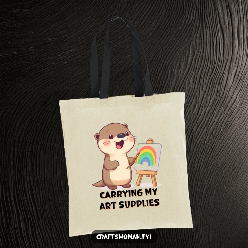 Funny otter tote bag illustrating a happy otter painting a bright rainbow on a canvas, great for art supplies.