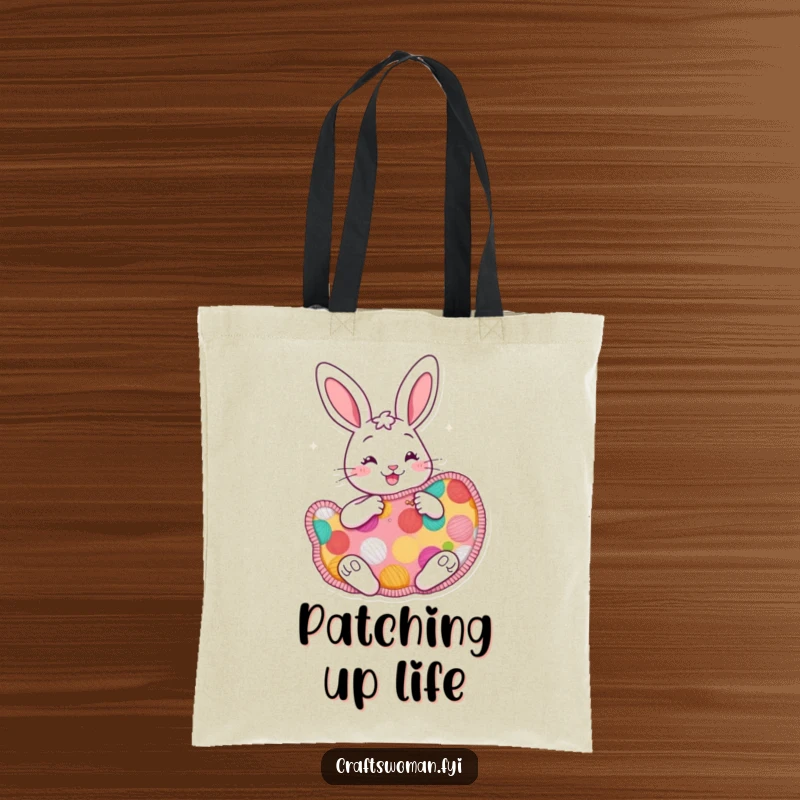 Funny cheerful bunny tote bag with a bunny enthusiastically sewing a large, colorful patch, perfect for carrying craft supplies.
