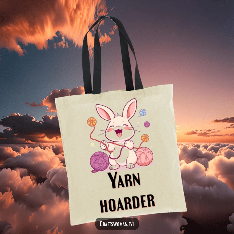 Funny tote bag featuring a laughing rabbit juggling colorful yarn balls, perfect for carrying knitting supplies and everyday essentials with humor.